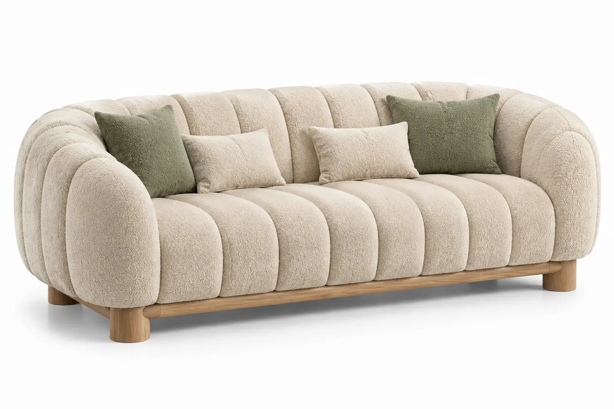 Beige and brown curved upholstered sofa with channel-tufted cushioning, stylish and comfortable in a modern living room setting.